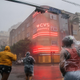 A group of people cross an intersection during Hurricane Ida on August 29, 2021 in New Orleans, Louisiana.
